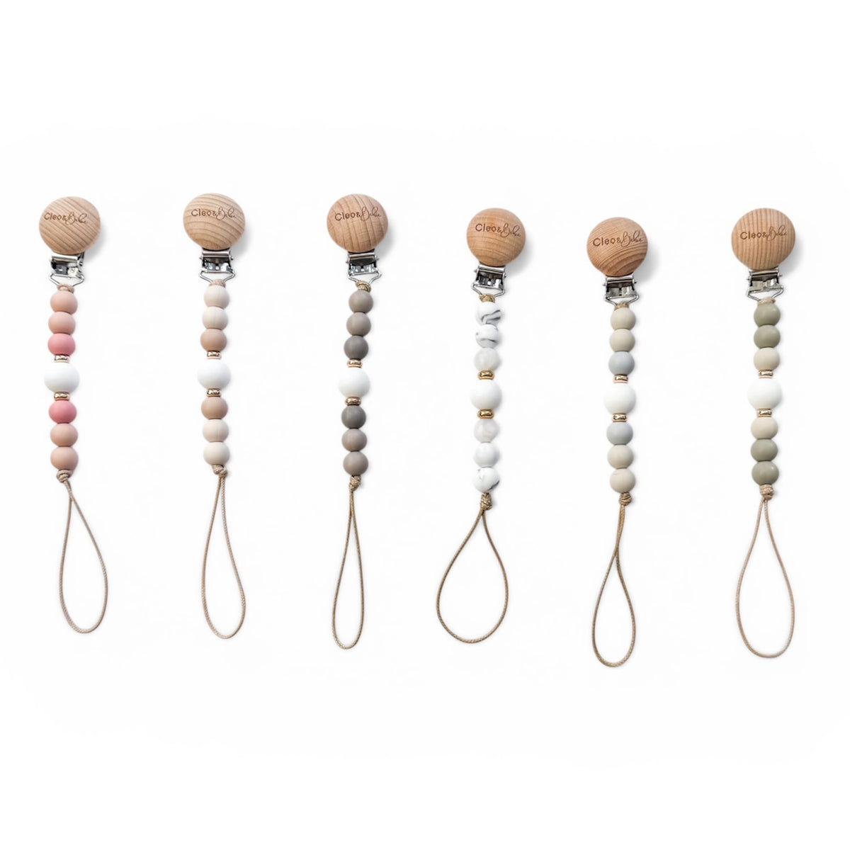 Set of six pacifier clips with wooden beads on a white background